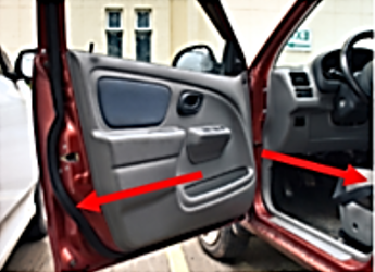 Arrow pointing to the inside of the doorpost or door edge identifying location of the tire placard.